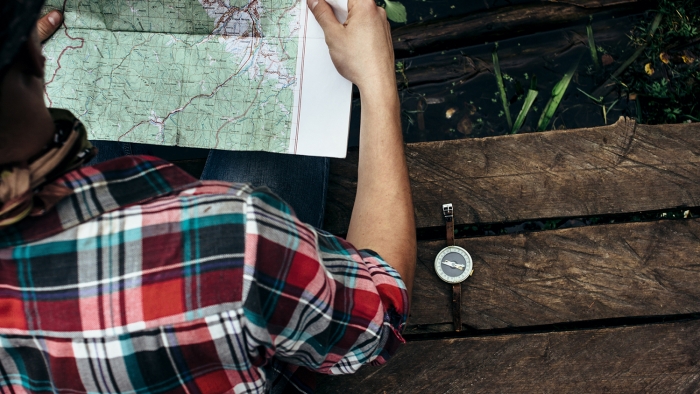 man looking at map